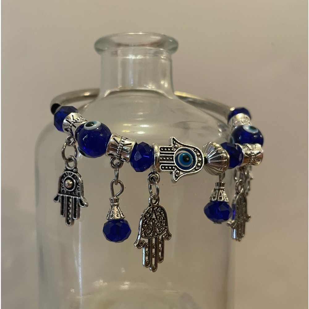 Small blue elastic silver evil eye charm bracelet